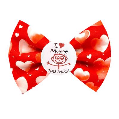 Pet themed dog bow tie for other's Day. Red bow with pink, red and white hearts printed on it. Badge in the middle. that reads " I love my Mummy this much" with a child like drawng of a stick person, holding out thier arms. 