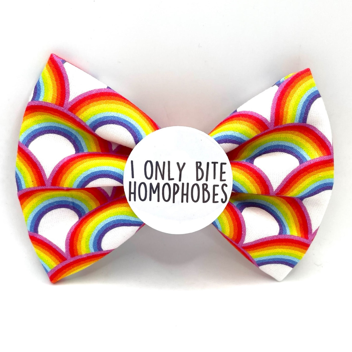pet bow tie. White base, with rainbow pattern all over. White badge in the centre that says " I only bite homophobes"