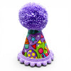 Colour party hat for dogs. Purple Pom Pom on the top, with a purple pom pom trim along the bottom. 