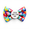 Colourful dog bow tie with heart pattern and text 'Cuter than your kid!' on a white background