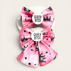 Two pink bows bows with a pink watercolor texture, decorated with black crowns, stars, and dots, and featuring a white badge that reads 'QUEEN BITCH' in black text.