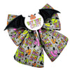A Halloween bat themed Sailor bow for dogs, featuring colourful emoji poo’s and bat wings. Badge in the middle that says “BAT SHIT CRAZY” 