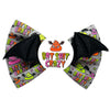 A novelty dog bow featuring a grey fabric printed with Halloween themed poop illustrations and the text 'BAT SHIT CRAZY' in colourful letters, with black bat-wing shaped loops on each side and a white centre circle showing the same logo.