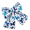 Blue and white birthday-themed decorative dog bow with balloons and 'It's my Birthday' text.