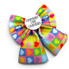 Colourful dog bow with heart pattern and 'Everybody Love Everybody' text on a white background
